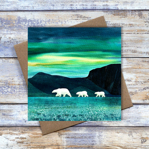 Polar Bear greetings card or Christmas card.  Polar bear cubs following their mother under the northern lights. By Barbara Jane Art & Design.